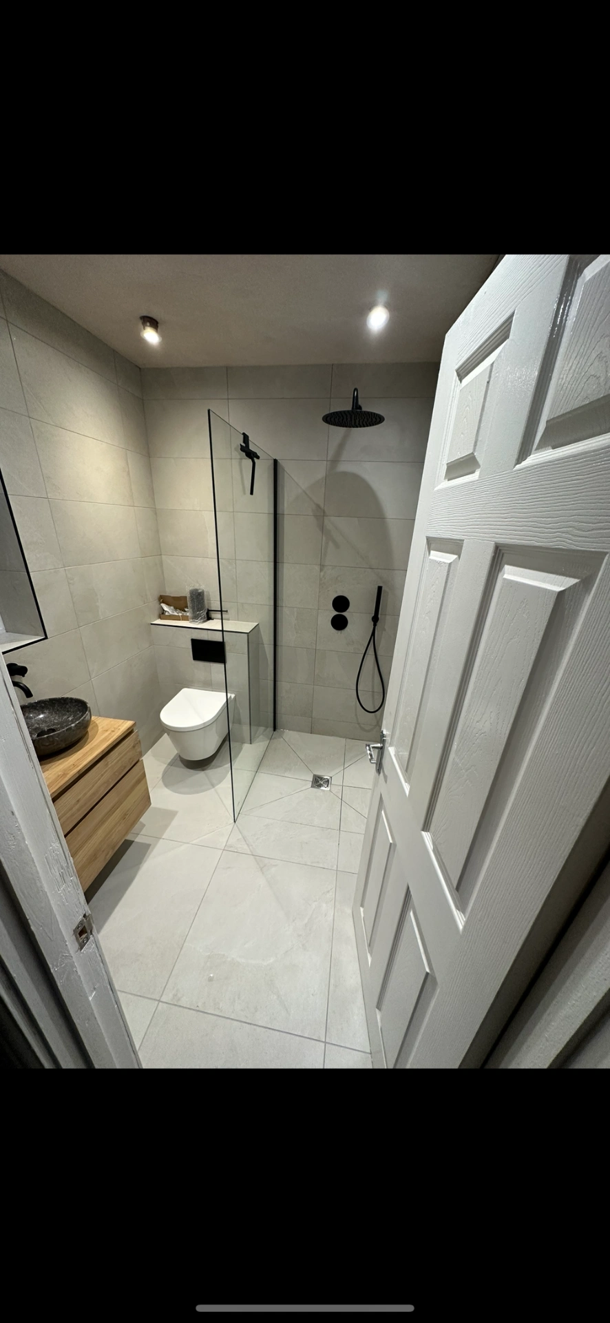 Ensuite with oak vanity, stone vessel basin and matte black walk-in shower